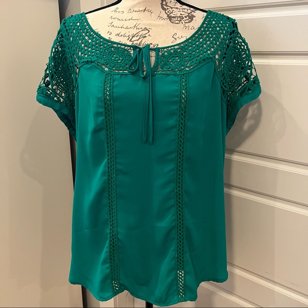 Beautiful green blouse with crocheted neck and sleeve details